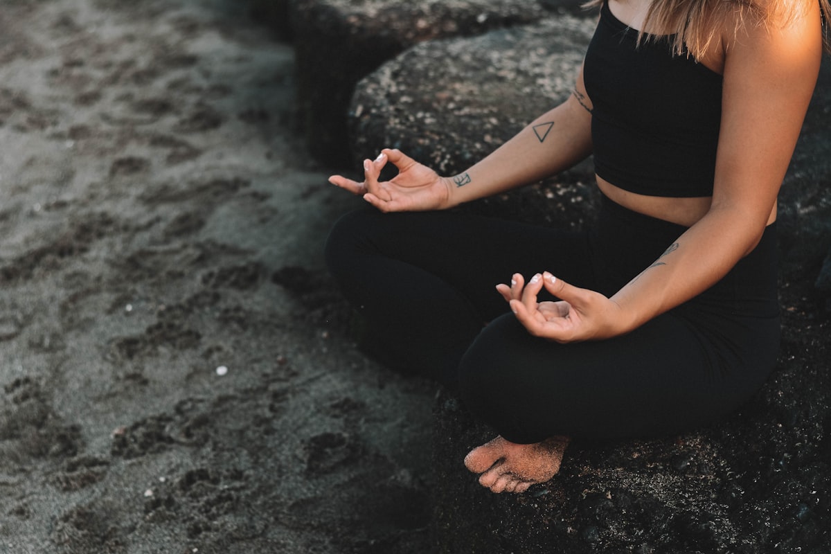 Woman practicing yoga breathing technique with peaceful expression